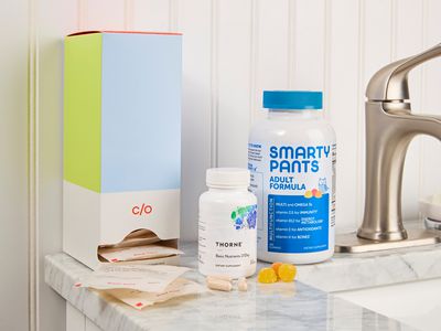 A selection of our favorite multivitamins arranged on a bathroom sink